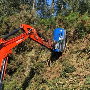 flail mower destroying bushes on kubota excavator