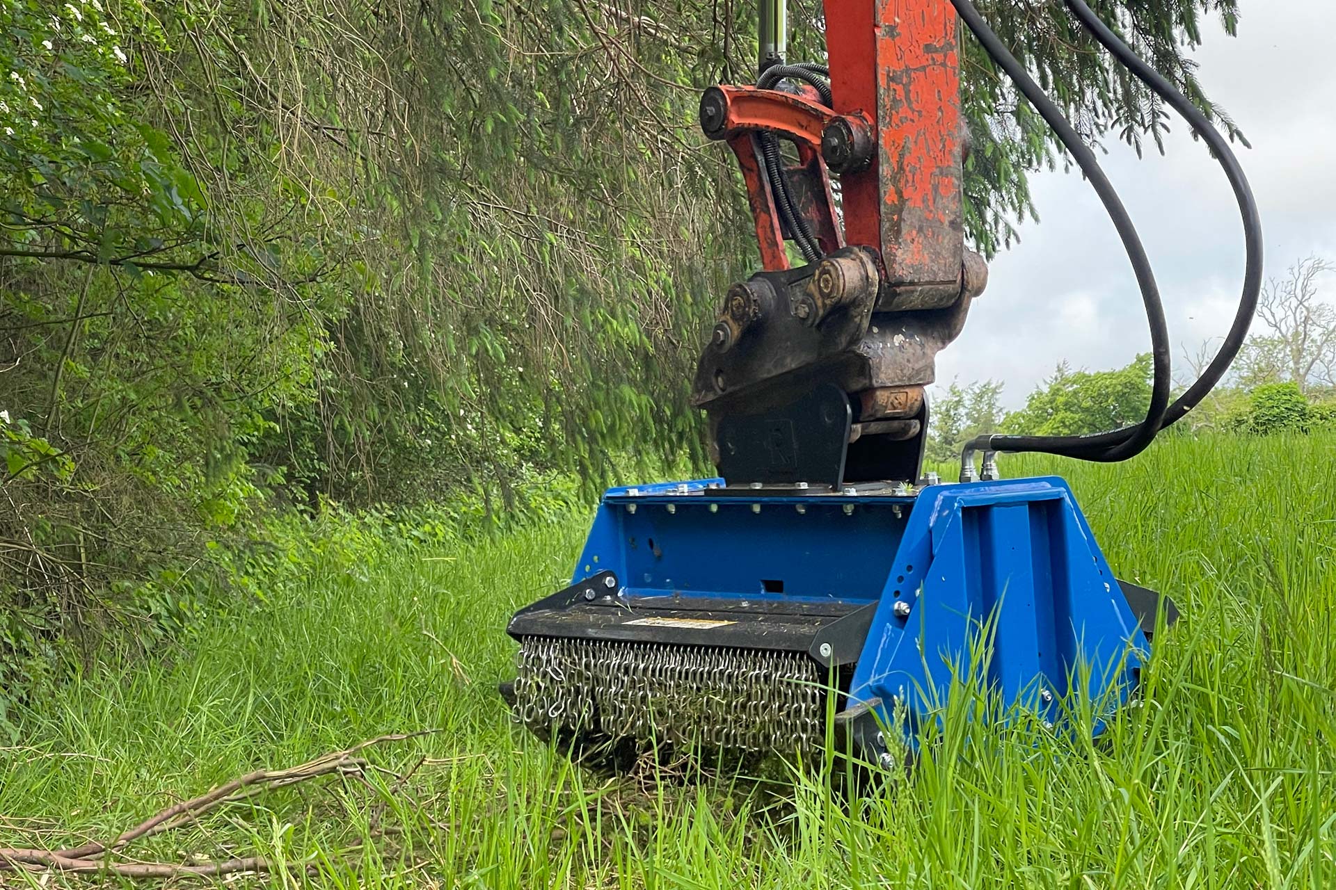 LS5 1000 Clearing grass and tree branches.