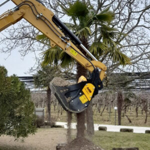 MB HDS 212 on cat digger working in front of palm tree