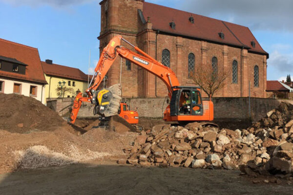 Doosan with BF90 with church backdrop