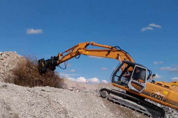 Mb Crusher demolition grab on a digger at work