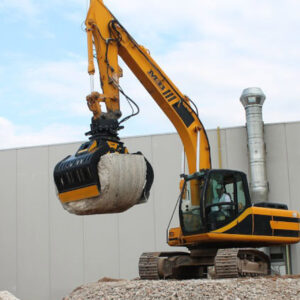 MB Crusher selector grab lifting stone on site